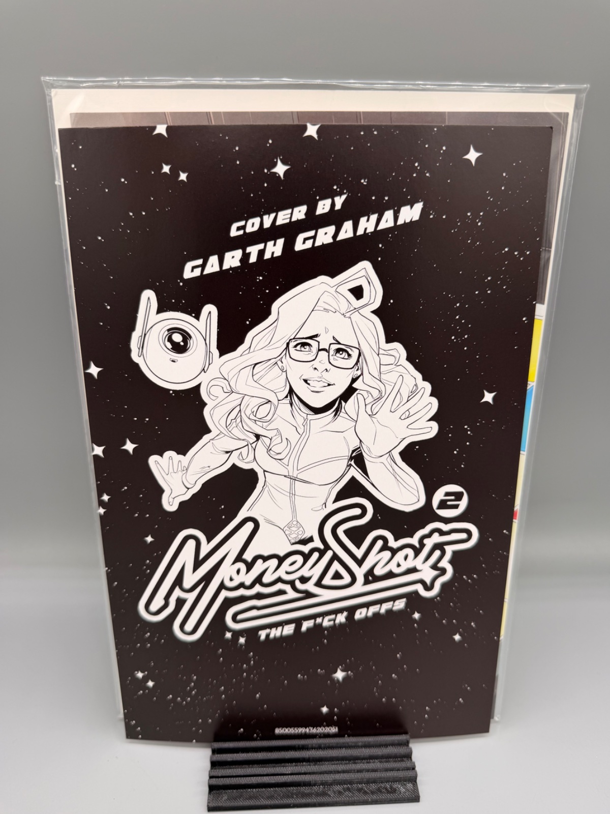 MONEY SHOT THE F* OFFS #2 (OF 5) CVR E GARTH GRAHAM NSFW BLACK BAG FULL ART VAR (MR) — Actual book · photo 1